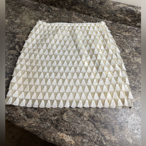 EUC Lulus mini skirt. Cream tassels,  lined, side zipper. 16.5” long. Size Small - Picture 1 of 7